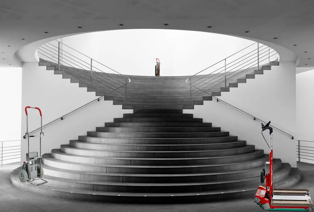 An electric stair climbing dolly at the foot of a staircase