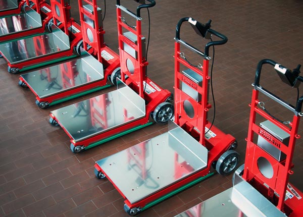 A row of Zonzini powered stair climbing hand trucks